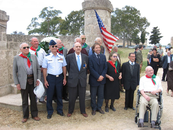 24 Pete with Italian citizens in front of memorial